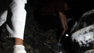 Peritos forenses inspeccionan el lugar donde el supuesto jefe de  'El Chapo' Guzmán, falleció luego de un operativo de la Marina.