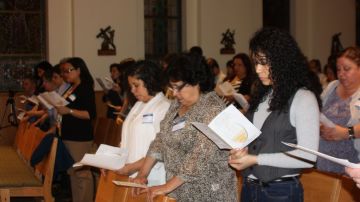 Integrantes de la Pastoral Migratoria en la ceremonia en el Archdiocesan Meyer Center, en el sur de la ciudad.
