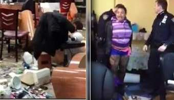 Imagen del video en que se ve a la mujer siendo arrestada luego de destrozar por completo el salón de belleza.