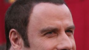 John Travolta y su esposa.