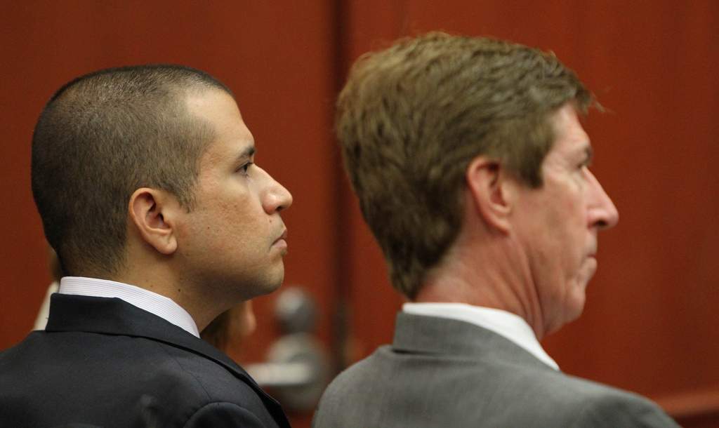 George Zimmerman (izq) y su abogado Mark O'Mara.