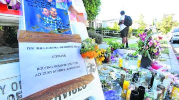 Familiares y amigos de las víctimas levantaron  un altar con fotos, flores y mensajes en el lugar donde ocurrió el accidente.