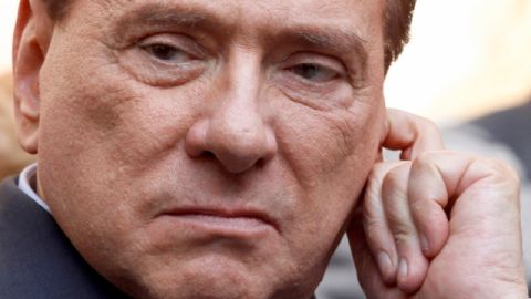 FILE - In this Friday, May 11, 2012 file photo, Italian former premier Silvio Berlusconi grimaces as he attends the funeral service of Italian entrepreneur Giampiero Cantoni in Milan, Italy. A court in Italy has convicted, Firday, Oct. 26, 2012, former Premier Silvio Berlusconi of tax fraud and sentenced him to four years in prison. In Italy, cases must pass two levels of appeal before the verdicts are final. Berlusconi is expected to appeal.(AP Photo/Luca Bruno, File)