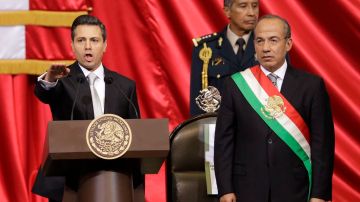 En medio de protestas, Peña Nieto toma posesión como nuevo presidente de México.