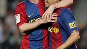Los socios del gol. Lionel Messi y Xavi Hernández aspiran vencer al Real Madrid en los clásicos del Rey.