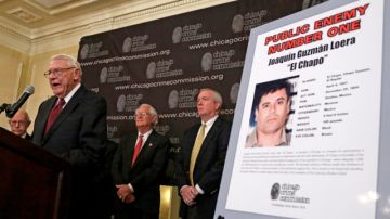 Al Bilek, Executive Vice President of the Chicago Crime Commission, left, accompanied by Peter Bensinger former Administrator of the United States Drug Enforcement Administration, and Jack Riley, right, Special Agent In Charge for the DEA Chicago Field office, announce that Joaquin ``El Chapo'' Guzman, a drug kingpin in Mexico, is Chicago's Public Enemy No. 1.  during a news conference Thursday, Feb. 14, 2013, in Chicago. It is first time since prohibition, when the label was  created for Al Capone, that anyone else has been designated Public Enemy No. 1. (AP Photo/M. Spencer Green)