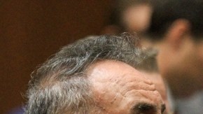 Former Bell, Calif. mayor Oscar Hernandez, left, and defendant Victor Bello, right listens to closing arguments in a massive city corruption trial in a downtown Los Angeles courtroom Wednesday, Feb. 20, 2013. The former mayor and vice mayor and four former city council members of the Los Angeles suburb of Bell are charged with misappropriation of public funds in a plot to line their own pockets at the expense of citizens.  Also on trial are former vice mayor Teresa Jacobo, and former council members, George Mirabal, George Cole,  and Luis Artiga. (AP Photo/Los Angeles Times, Irfan Khan, Pool)