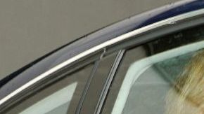 La infanta Cristina  sale de su casa para acudir a la sede central de la Caixa en Barcelona para incorporarse a su puesto de trabajo.