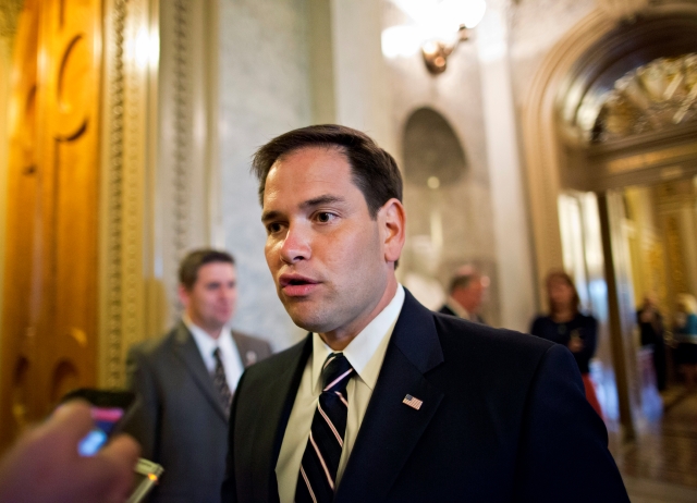 In this photo taken Monday, May 6, 2013, Sen. Marco Rubio, R-Fla., arrives at the Senate chamber for a vote, on Capitol Hill in Washington.  One of the immigration bill's authors, Sen. Marco Rubio, R-Fla., has already acknowledged that the bill will face a tough road to passage if the border security elements are not improved. (AP Photo/J. Scott Applewhite)