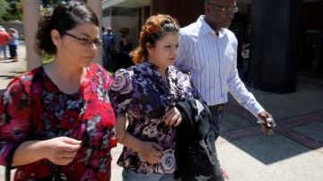 Priscilla Rodriquez, center, the mother of murder victim of Leila Fowler, leaves the Calaveras County Courthouse, in San Andreas, Calif.,  after the arraignment of  her 12-year-old son for Leila's  murder, Wednesday, May 15, 2013.  Leila Fowler, 8, was stabbed to death in her Valley Springs home, last month.  The defendant was charged with second-degree murder and a special allegation for use of a dangerous weapon for the death of Leila Fowler. No plea was entered. (AP Photo/Rich Pedroncelli)