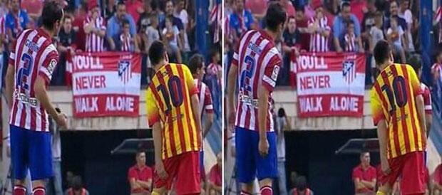 En la imagen se observa como Diego Godín hace señas a sus compañeros, indicando la parte donde Messi se encuentra lesionado
