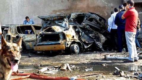 Security officials examine the site of a car bomb in the Suez Canal city of Ismailia, Egypt, Saturday Oct. 19, 2013. A car bomb exploded Saturday near an Egyptian military intelligence compound in the Suez Canal city of Ismailia, wounding several soldiers, security officials said, as militants appear to be expanding the scope of attacks beyond the restive Sinai Peninsula. (AP Photo)