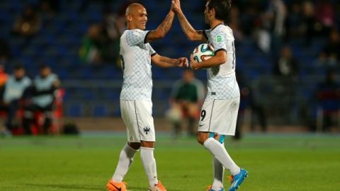 Humberto Suazo y César "Chelito" Delgado celebran uno de los goles del Monterrey