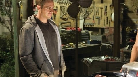 Walker (i), quien protagonizaba a Brain O'Connor en la saga “Fast and Furious" junto a Vin Disel (d).