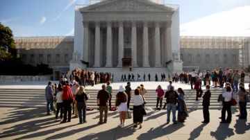 People wait in line to enter the Supreme Court in Washington  (AP Photo/Carolyn Kaster)