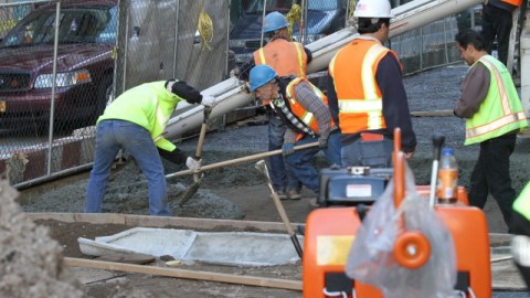Construction workers fixing bridges and city streets in Manhattan.