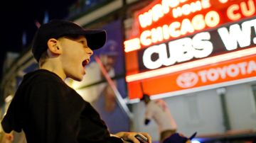 CHICAGO, IL - OCTOBER 13: Jaden Klein, 11 of Chicago, celebrates outside of Wrigley Field after the Chicago Cubs beat the St. Louis Cardinals in Game Four to win the National League Divisional Series on October 13, 2015 in Chicago, Illinois.  (Photo by Jon Durr/Getty Images)