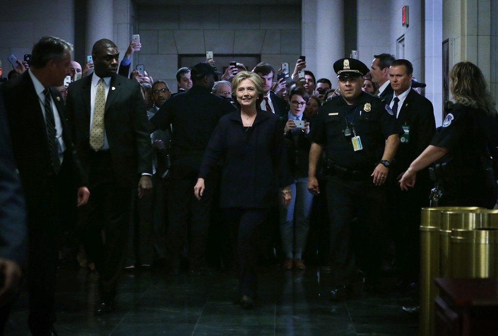 WASHINGTON, DC - OCTOBER 22: Democratic presidential candidate and former Secretary of State Hillary Clinton (C) arrives prior to testifying before the House Select Committee on Benghazi October 22, 2015 on Capitol Hill in Washington, DC. The committee held a hearing to continue its investigation on the attack that killed Ambassador Chris Stevens and three other Americans at the diplomatic compound in Benghazi, Libya, on the evening of September 11, 2012. (Photo by Alex Wong/Getty Images)