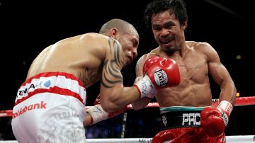 Miguel Cotto ha peleado menos rounds que 'Canelo' Álvarez, aunque le han pegado más, como cuando se enfrentó a Manny Pacquiao (foto) en 2009.