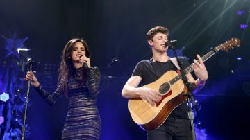 Camila Cabello of Fifth Harmony (L) performs with musician Shawn Mendes