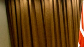 British Foreign Secretary Philip Hammond, right, walks away after shaking hands with Chinese Foreign Minister Wang Yi