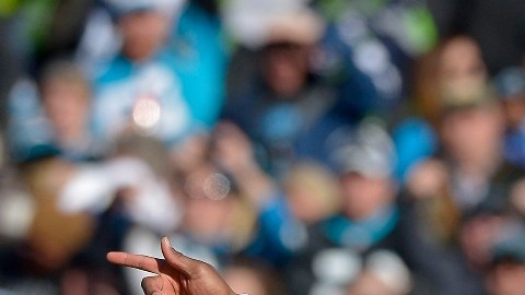 Cam Newton, estrella de los Panthers, celebra durante el partido de playoffs contra Seattle.