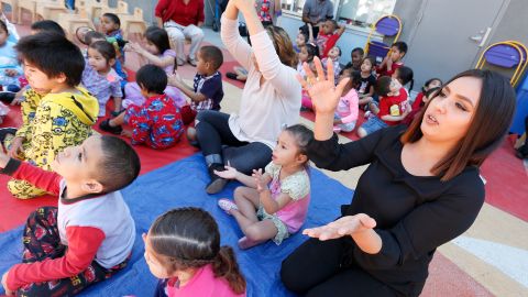 Sandra Nunez (R), mother of 3, participates in the unveiling during a press conference at the Los Angeles Trade-Technical College Child Development Center, a new child care program. Los Angeles Trade-Technical College (LATTC)Êand SEIU launched an innovative program to train childcare workforce in Los Angeles. Workers in early care and education in Los Angeles will be able to earn college credit, engage in career training, and simultaneously receive wage increases. (Photo by Aurelia Ventura/La Opinion)