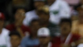 El jugador de Venados de Mazatlan, Jesús Esteban Quiroz batea una bola,  ante los Leones del Escogido.