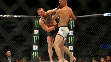 Conor McGregor y Nate Díaz durante su primera pelea en la función UFC 196 en Las Vegas.