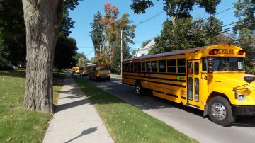 School bus procession in memory of Clinton Gerould "Jerry Schoonover
