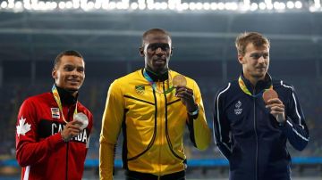 De Grasse, Bolt y Lemaitre en el podio de los 200 m.