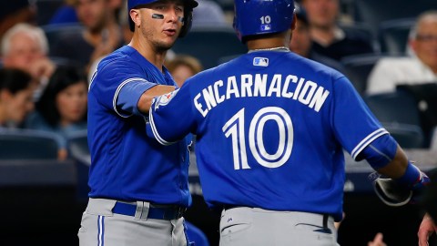 NEW YORK, NY - AUGUST 16: Troy Tulowitzki #2 congratulates Edwin Encarnacion #10 of the Toronto Blue Jays after he hit a two run home run during the sixth inning of a game against the New York Yankees at Yankee Stadium on August 16, 2016 in the Bronx borough of New York City. (Photo by Rich Schultz/Getty Images)