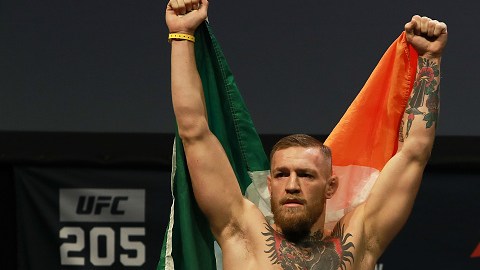 NEW YORK, NY - NOVEMBER 11:  UFC Featherweight Champion Conor McGregor reacts as he walks on stage for  UFC 205 Weigh-ins at Madison Square Garden on November 11, 2016 in New York City.  (Photo by Michael Reaves/Getty Images)