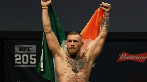 NEW YORK, NY - NOVEMBER 11: UFC Featherweight Champion Conor McGregor reacts as he walks on stage for UFC 205 Weigh-ins at Madison Square Garden on November 11, 2016 in New York City. (Photo by Michael Reaves/Getty Images)