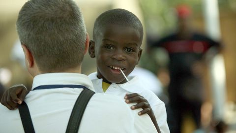 A Haitian child awaits transport Decembe