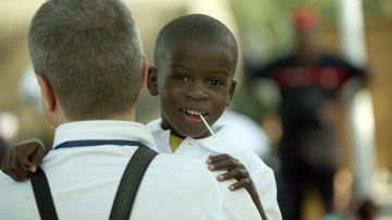 A Haitian child awaits transport Decembe