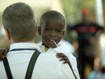 A Haitian child awaits transport Decembe