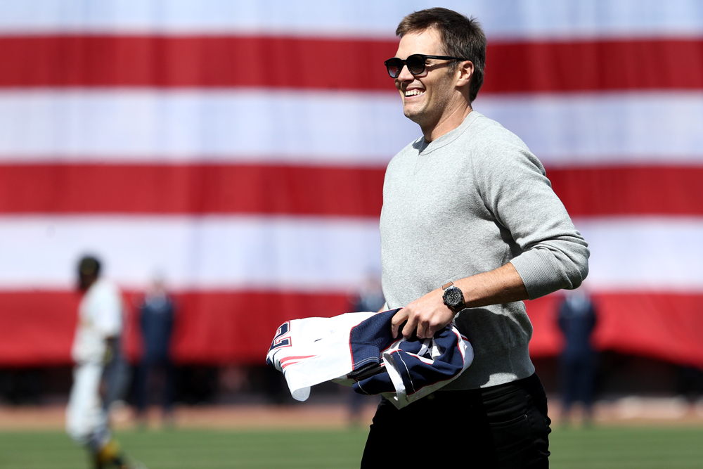 BOSTON, MA - APRIL 3: Tom Brady #12 of the New England Patriots looks on after throwing out the first pitch before the opening day game between the Boston Red Sox and the Pittsburgh Pirates at Fenway Park on April 3, 2017 in Boston, Massachusetts. (Photo by Maddie Meyer/Getty Images)
