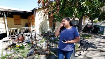 04/18/17/LOS ANGELES/ Beatriz Galicia visits the burned house where she lost her mother, Maria Eugenia, in a fire. Beatriz is dealing with a double tragedy, the death of her mother and her husband not being allowed back into the country after returning to El Salvador to fix his immigration status.  (Photo by Aurelia Ventura/La Opinion)