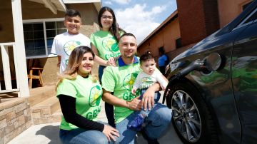 04/19/17/LOS ANGELES/ Daniel Figueroa with his wife Alondra and children, Leslie, 16, Daniel, 10, and 9 month old David, show their new plug-in hybrid and electric-vehicle charging station on their property in East Los Angeles.Ê Utilizing funds made available through legislation authored by Senator de Leon, SB 535, this family of five is already powering their home with solar energy installed by GRID Alternatives.Ê SB 1275 (de Leon), which created the ÒCharge AheadÓ program has allowed the FigueroaÕs to replace their vehicle with a plug-in hybrid and install an electric-vehicle charging station on their property. (Photo by Aurelia Ventura/La Opinion)