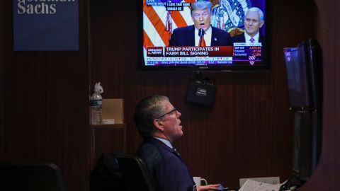 NEW YORK, NY - DECEMBER 20: President Donald Trump is displayed on a monitor as a trader works at his desk ahead of the closing bell on the floor to he New York Stock Exchange (NYSE), December 20, 2018 in New York City. The Dow Jones industrial average continued its tumultuous week, closing down over 460 points on Thursday, one day after the Federal Reserve raised the interest rate.