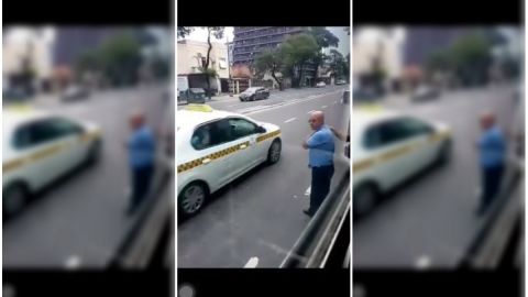 Chofer ayuda a cruzar calle a invidentes