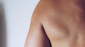 0_Rear-View-Of-Shirtless-Seductive-Woman-Sitting-On-Man-At-Home