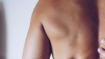 0_Rear-View-Of-Shirtless-Seductive-Woman-Sitting-On-Man-At-Home