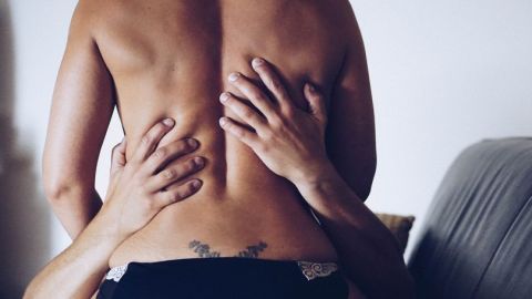 0_Rear-View-Of-Shirtless-Seductive-Woman-Sitting-On-Man-At-Home