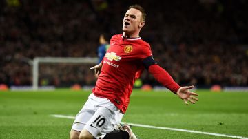 MANCHESTER, ENGLAND - MARCH 09:  Wayne Rooney of Manchester United celebrates after scoring a goal to level the scores at 1-1 during the FA Cup Quarter Final match between Manchester United and Arsenal at Old Trafford on March 9, 2015 in Manchester, England.  (Photo by Laurence Griffiths/Getty Images)