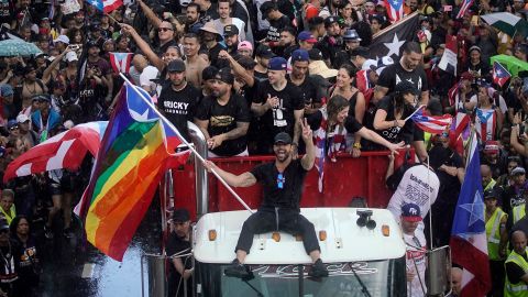 Puerto Rican singer Ricky Martin (C), alongside Puerto Rican rapper Rene Perez, aka Residente, march along Las Americas highway as they take part of a national strike demanding Puerto Rico's Governor Ricardo Rossello resignation in San Juan, Puerto Rico on, July 22, 2019. - Angry protesters blocked the main road in Puerto Rico's capital on Monday as they launched what was expected to be the largest yet of a wave of demonstrations seeking the resignation of the US territory's embattled governor. (Photo by Eric Rojas / AFP) (Photo credit should read ERIC ROJAS/AFP/Getty Images)