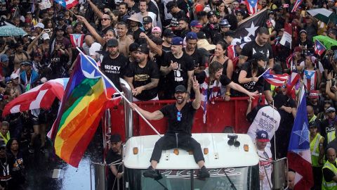 Puerto Rican singer Ricky Martin (C), alongside Puerto Rican rapper Rene Perez, aka Residente, march along Las Americas highway as they take part of a national strike demanding Puerto Rico's Governor Ricardo Rossello resignation in San Juan, Puerto Rico on, July 22, 2019. - Angry protesters blocked the main road in Puerto Rico's capital on Monday as they launched what was expected to be the largest yet of a wave of demonstrations seeking the resignation of the US territory's embattled governor. (Photo by Eric Rojas / AFP) (Photo credit should read ERIC ROJAS/AFP/Getty Images)