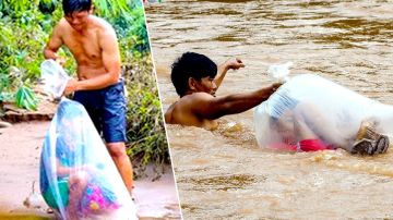 La crecida del río Nam Chim obliga a los niños a cruzar metidos en bolsas de plástico.