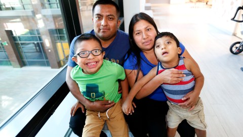 09/18/19 /LOS ANGELES/Zacarias Alonso Mendoza with his wife Juana Gomez Conseco and children, Ever Isaac Alonso Gomez, 7, Esdras Abraham Alonso Gomez, 3, is surprised by his immigration attorney Alex Galvez with his residency papers, during the live show of radio personality El Piolin. (Aurelia Ventura/La Opinión)